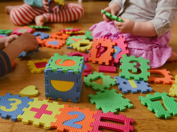 Board, cards and playing pieces from a Logic Roots math game